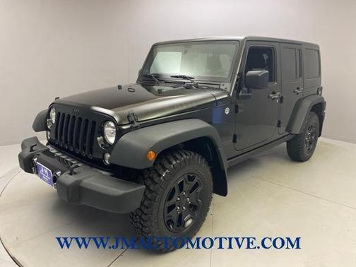 Photo 2 of 52 of 2014 Jeep Wrangler Unlimited Sport