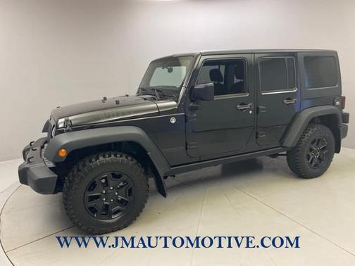 Photo 3 of 52 of 2014 Jeep Wrangler Unlimited Sport